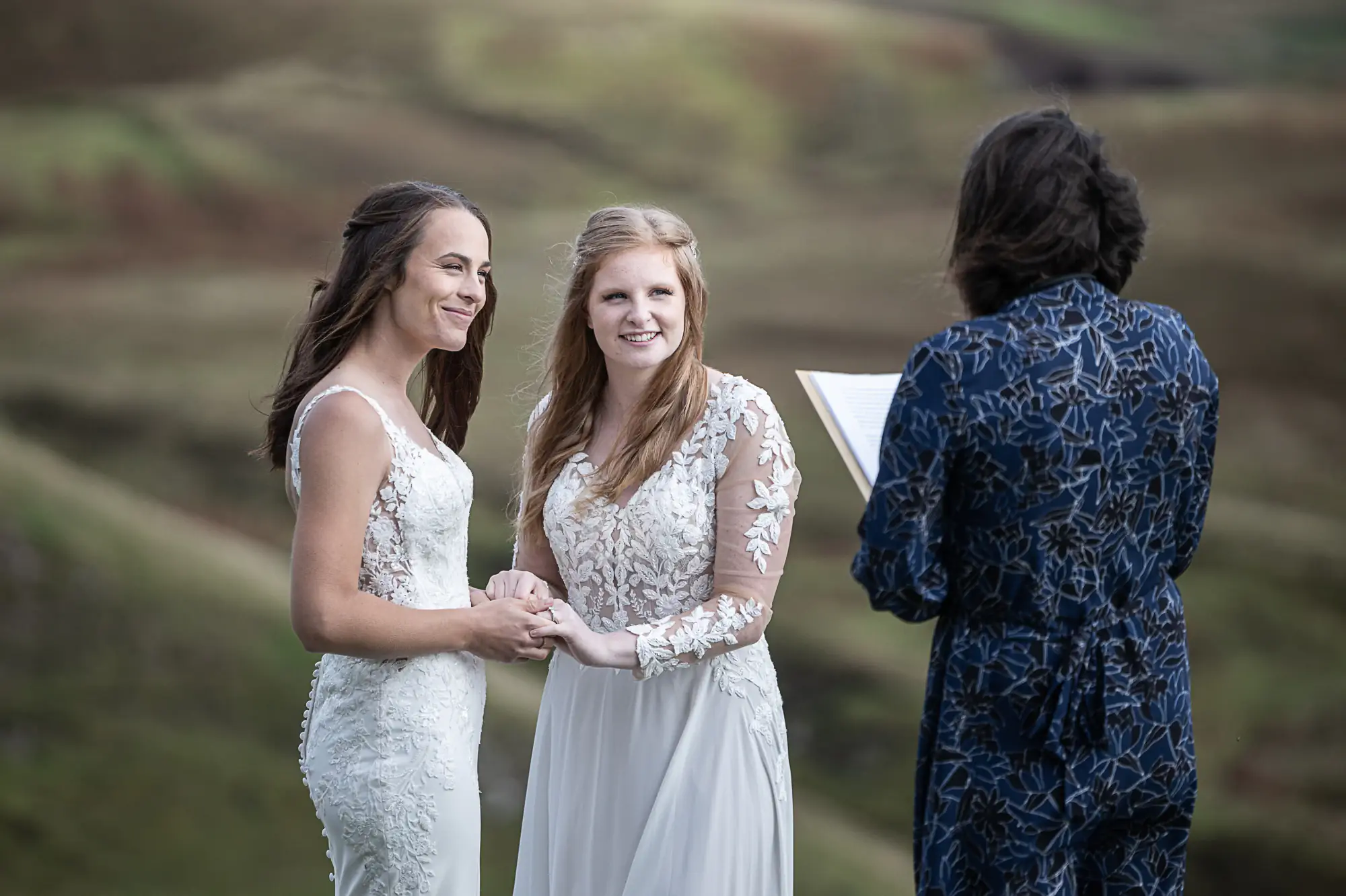 same-sex ladies hold hands