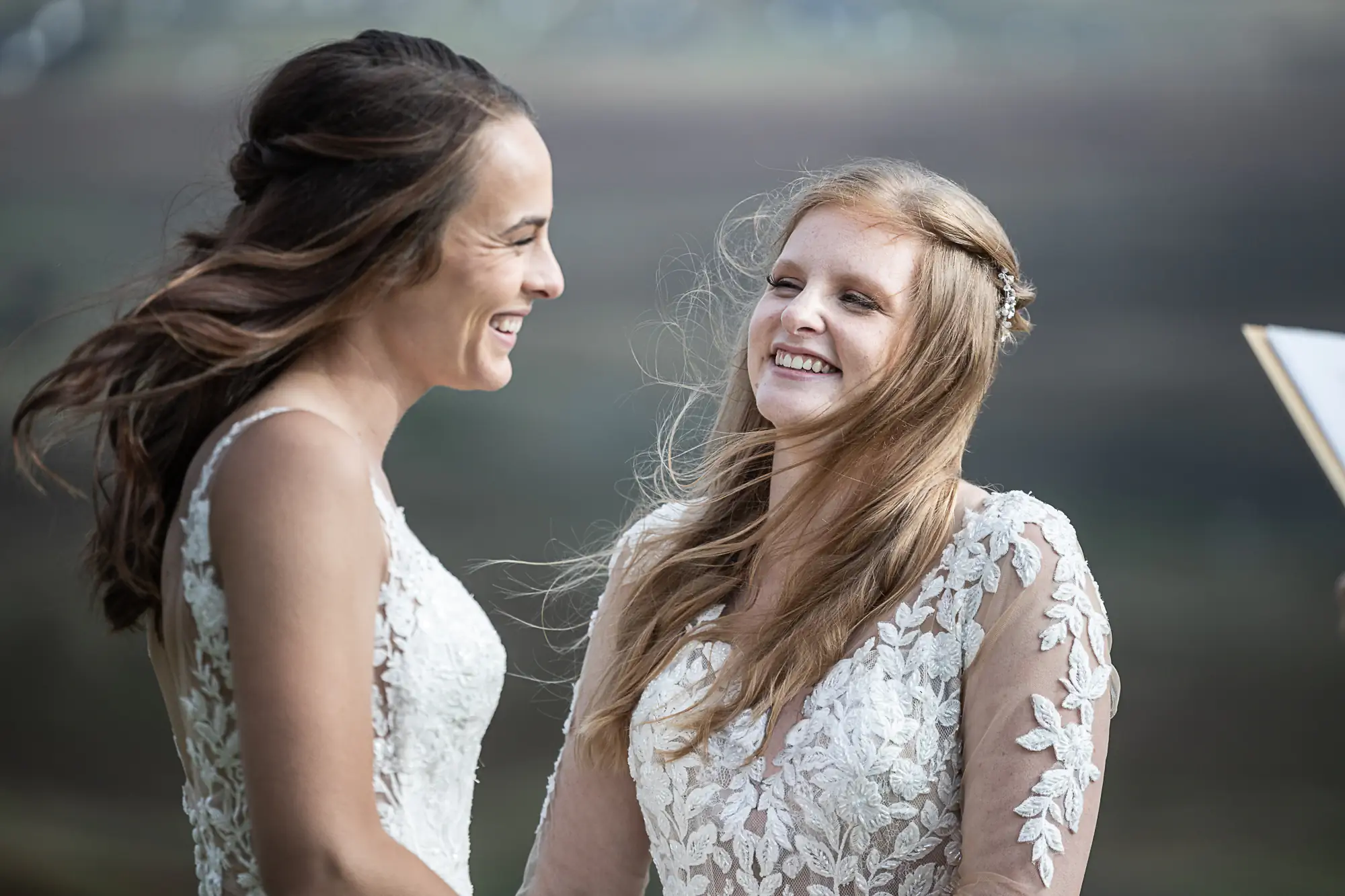 girls smiling at each other