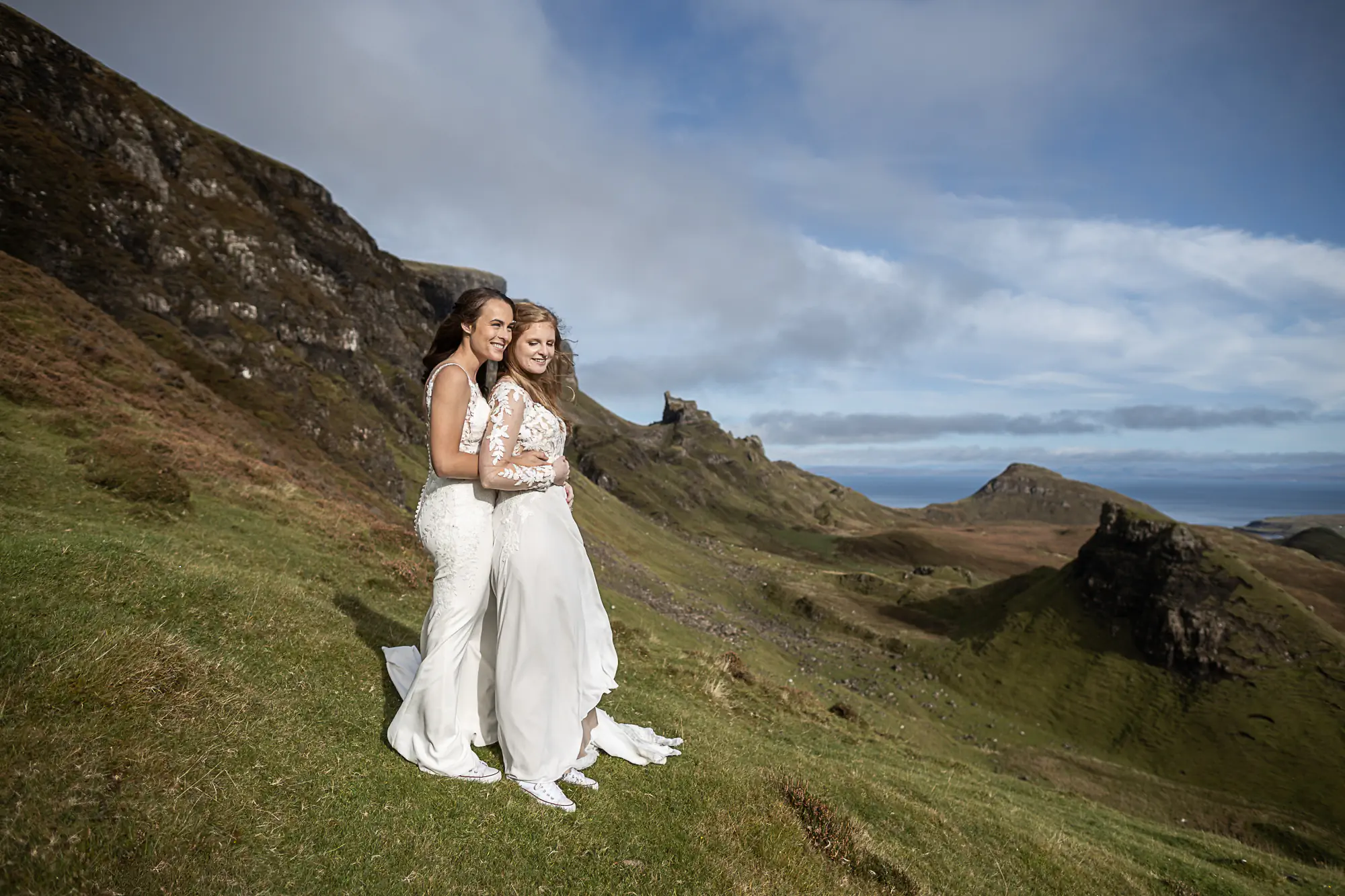 brides bask in the sun on the side of a mountain