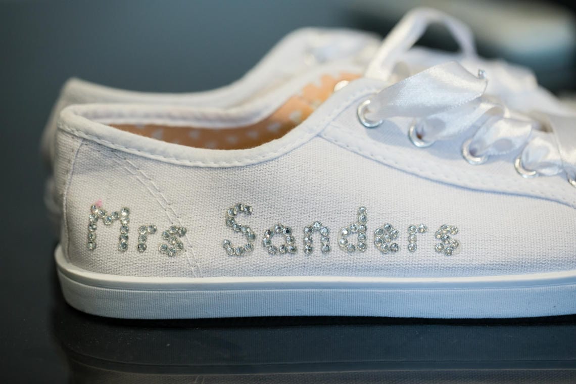 white bridal pumps with diamante lettering