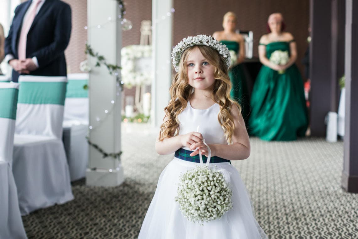 flower girl walking up the aisle