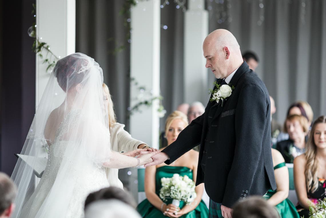 bride and groom exchange of vows during Humanist ceremony in the Heights Restaurant