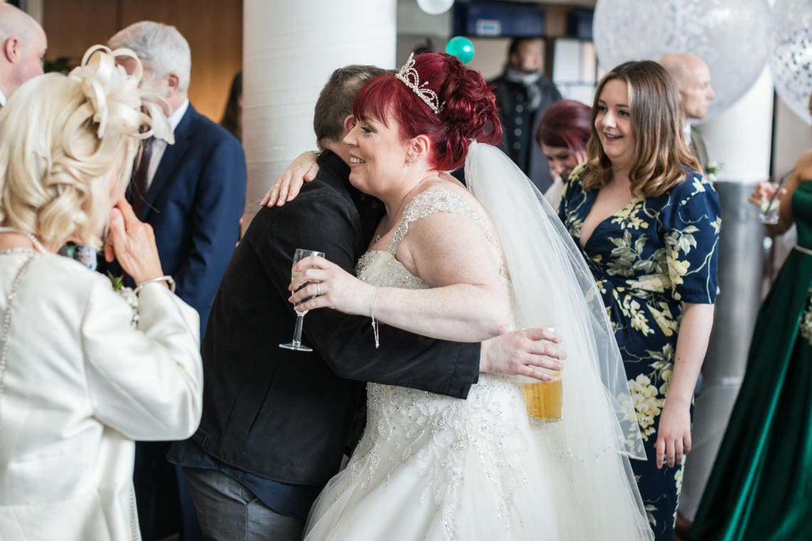 bride is congratulated by guests