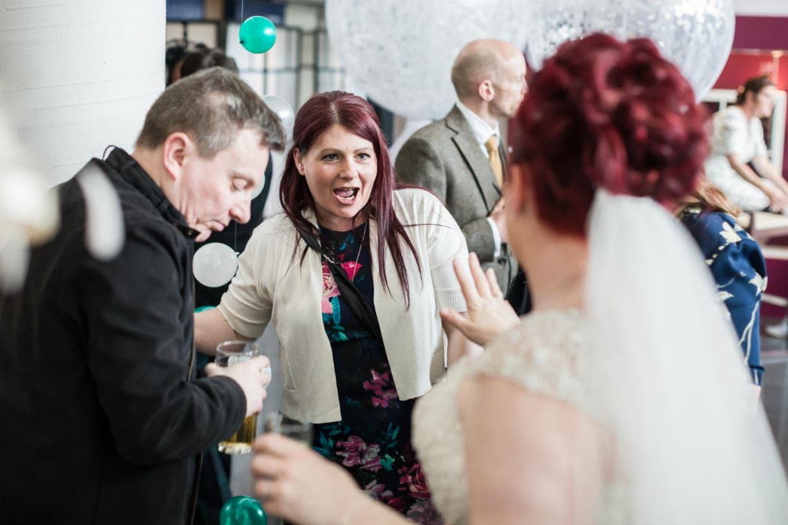 bride is congratulated by guests
