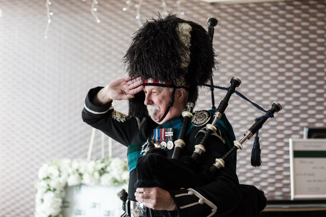piper salutes the newlyweds