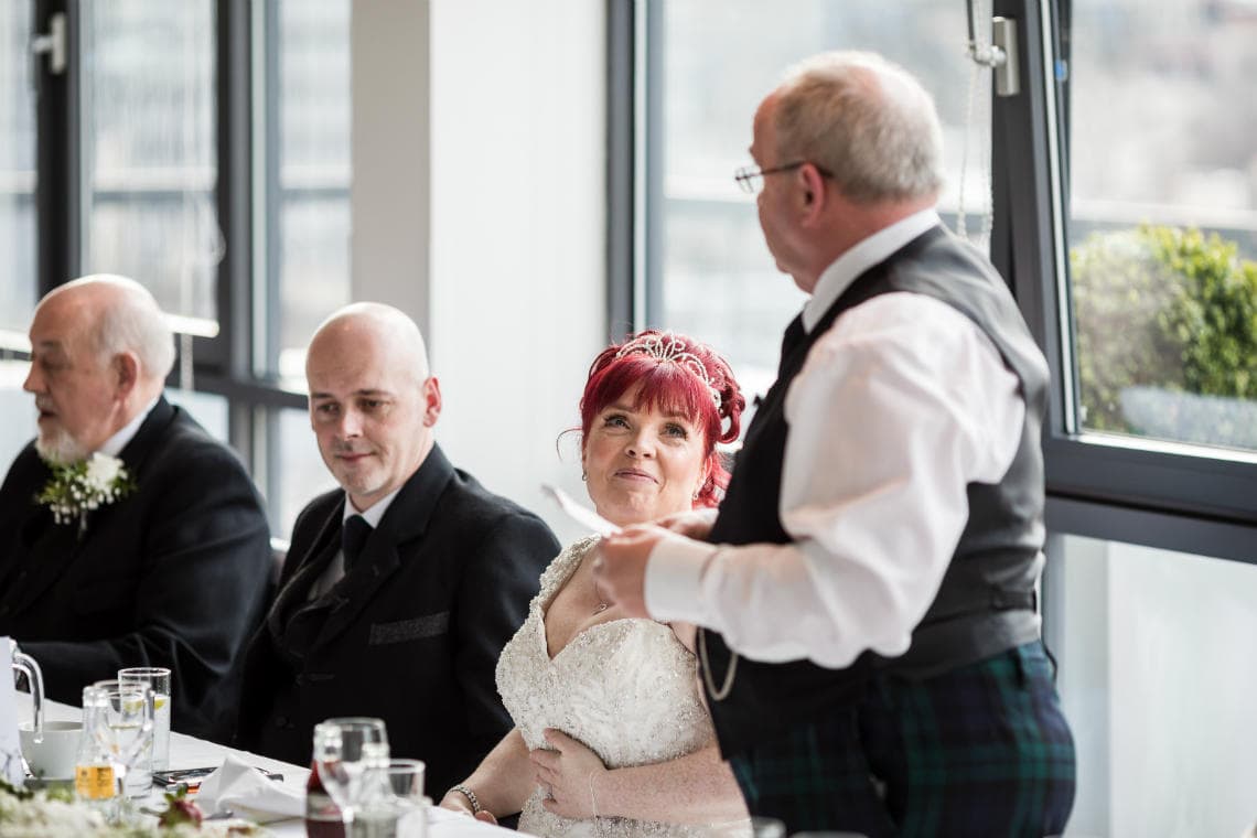 bride looking at her Dad during his speech