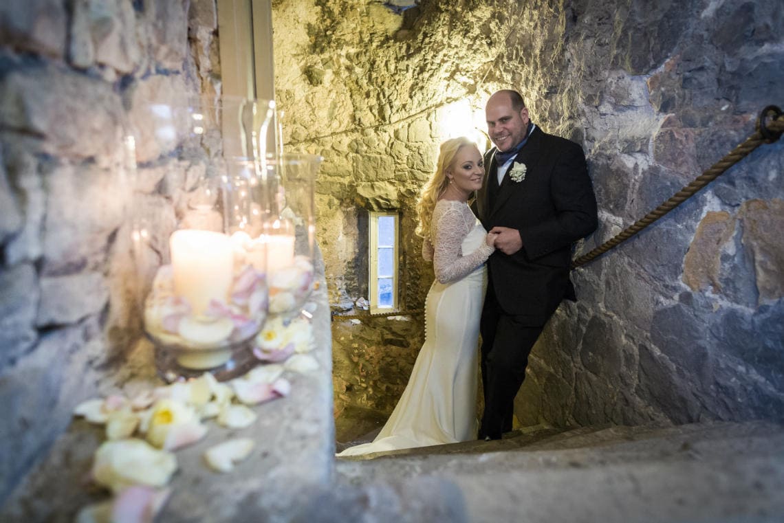 Auld Keep staircase newlyweds embrace