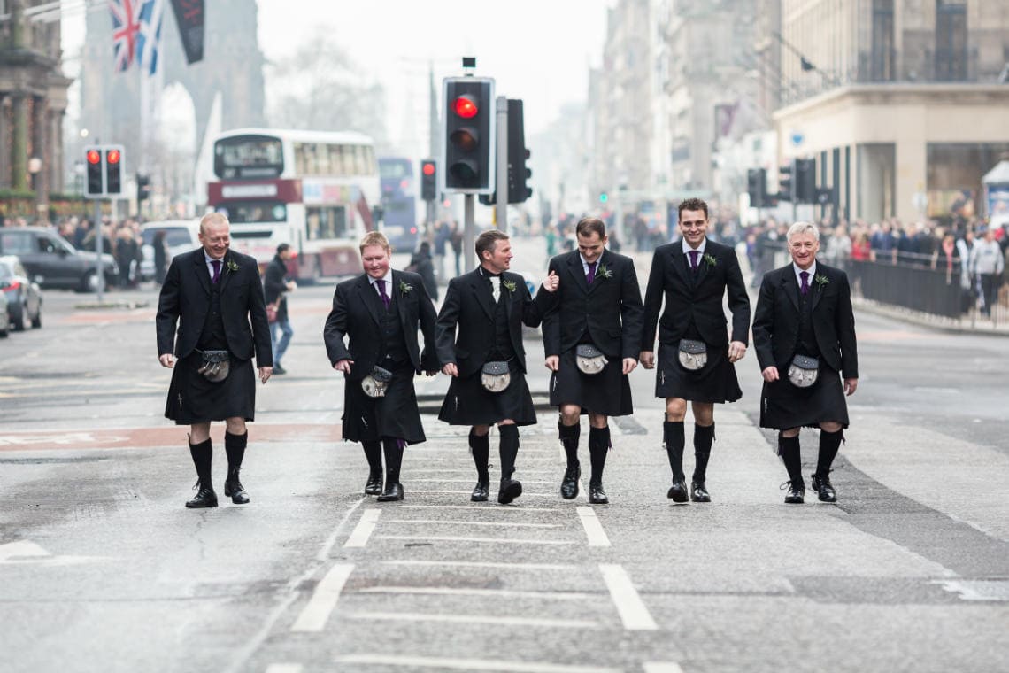groom and the boys walking along Waterloo Place