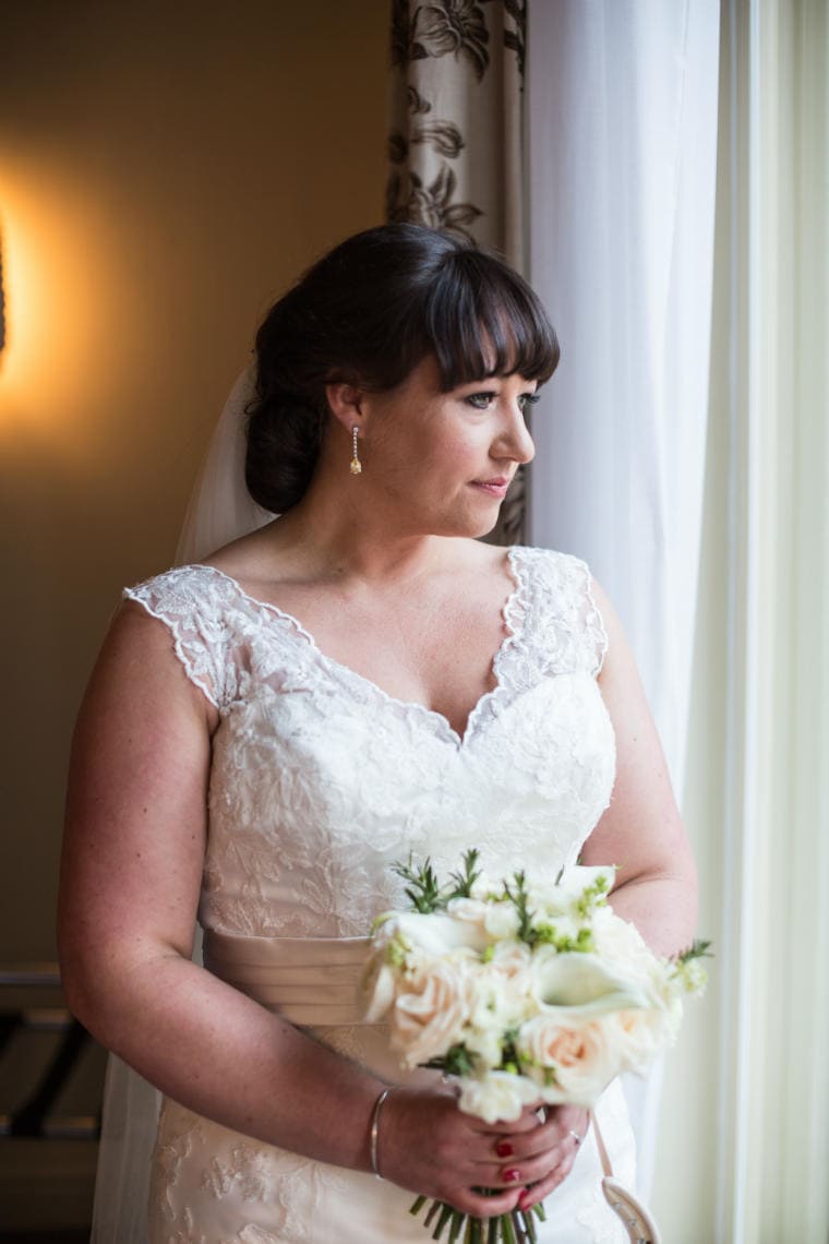 bride looking out of the window in the Balmoral Hotel