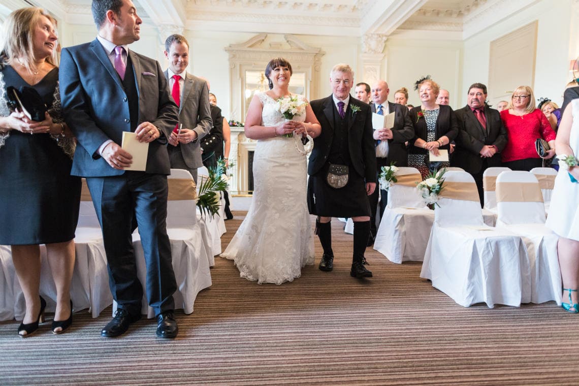 wedding processional in the Esk Suite bride and father
