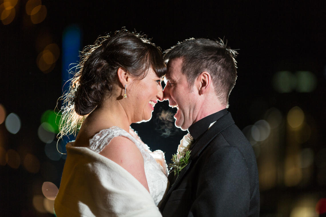 newlyweds backlit photo at night