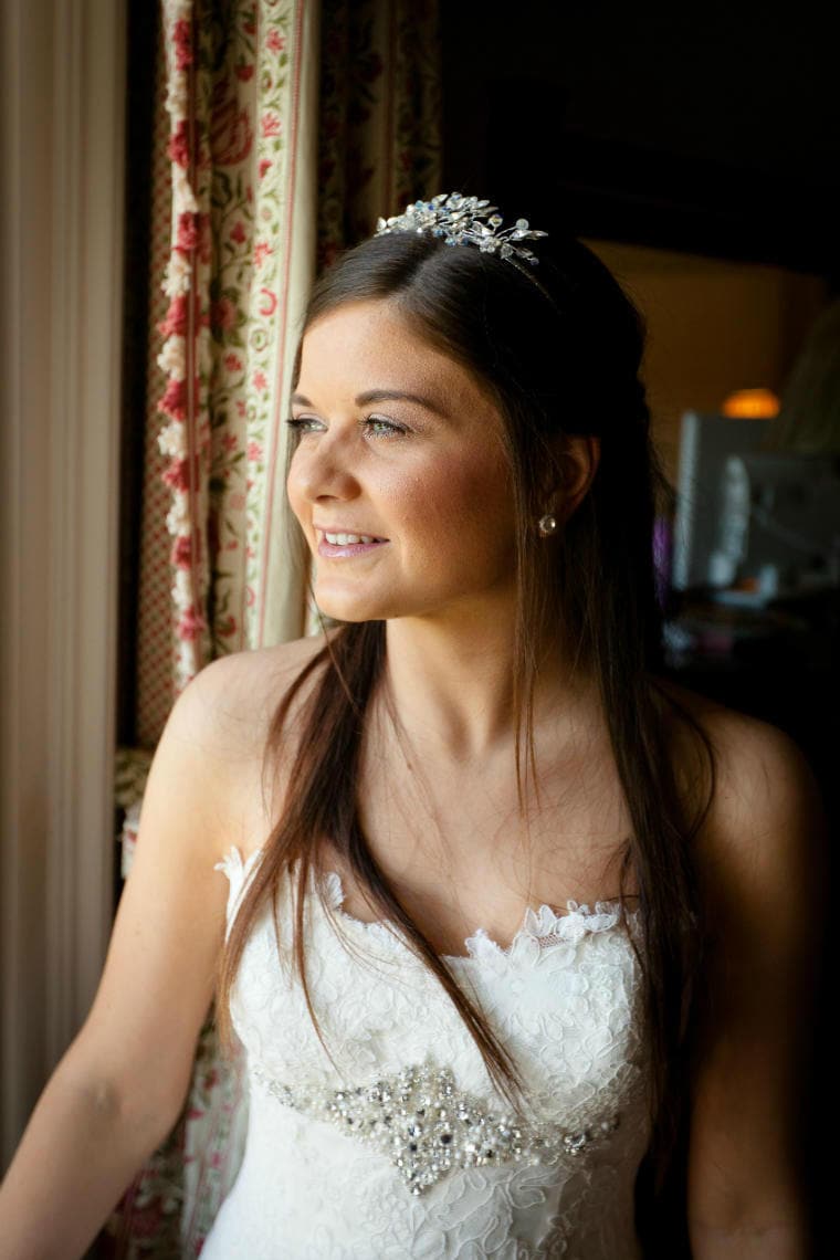 Bedroom bridal portrait by the window