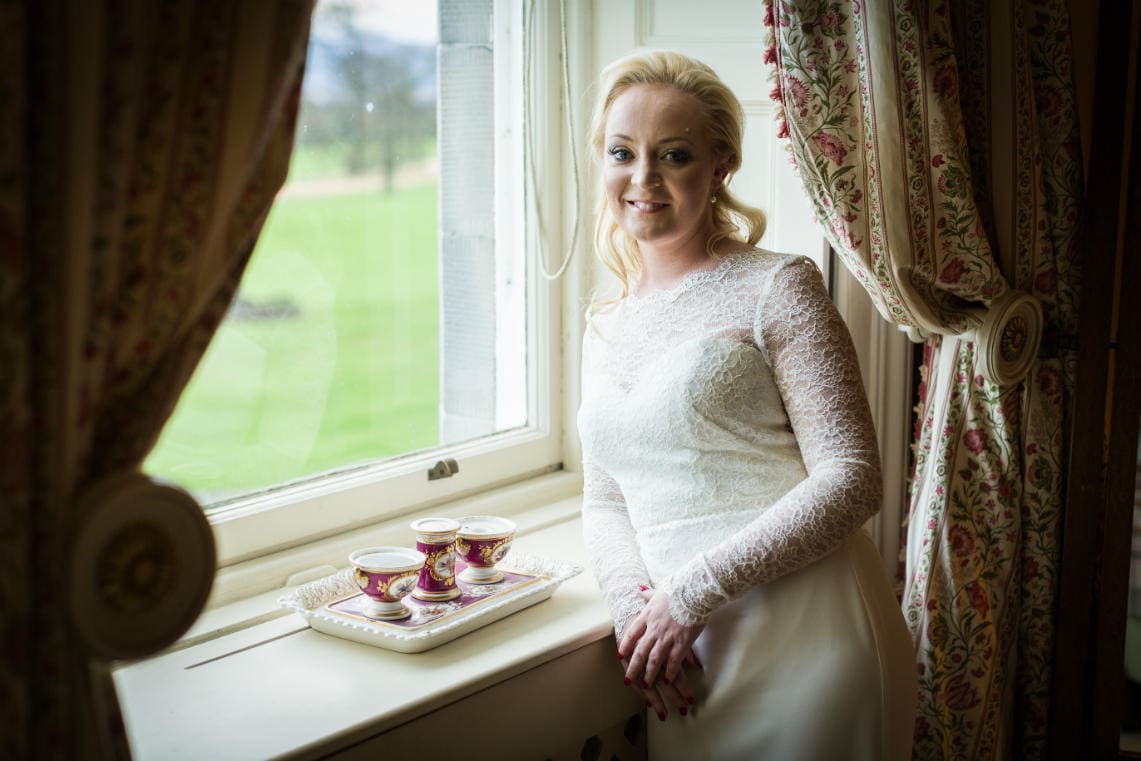 Bedroom bridal portrait next to the window