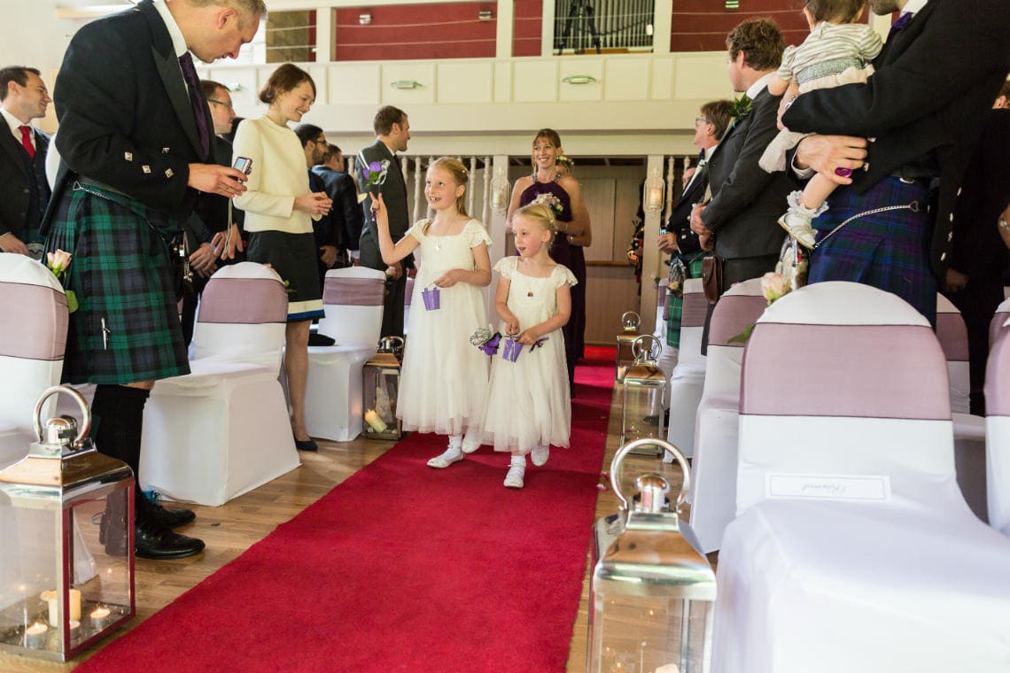 flower girls walking up the aisle in The Chapel