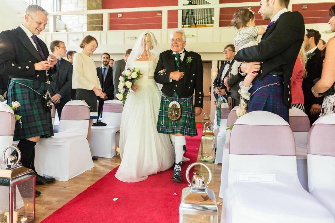 processional in the chapel as the bride walks up the aisle