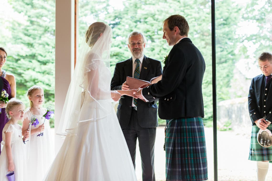 exchange of rings during Humanist ceremony in the Chapel