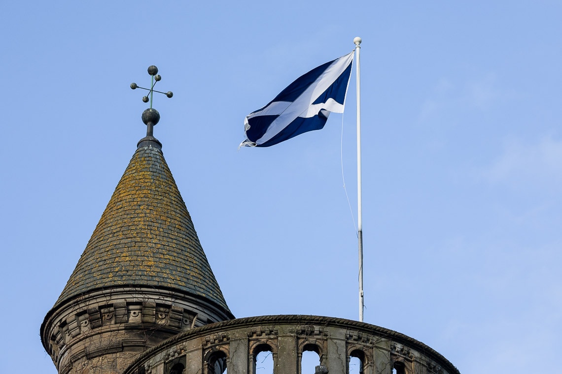 Scottish saltire flag waving on the roof