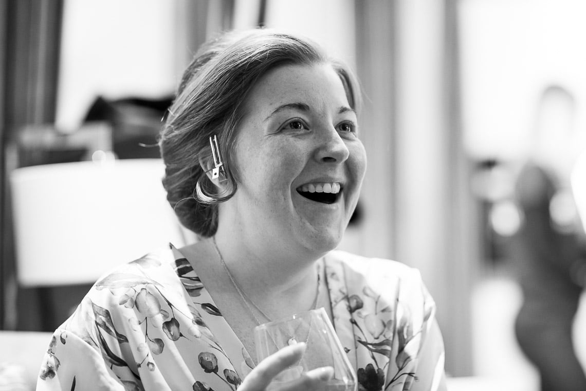 bride laughing during morning preparations