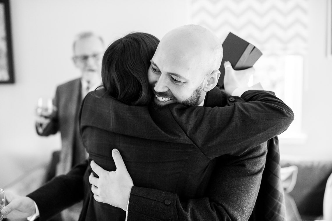groom hugs one his best friends