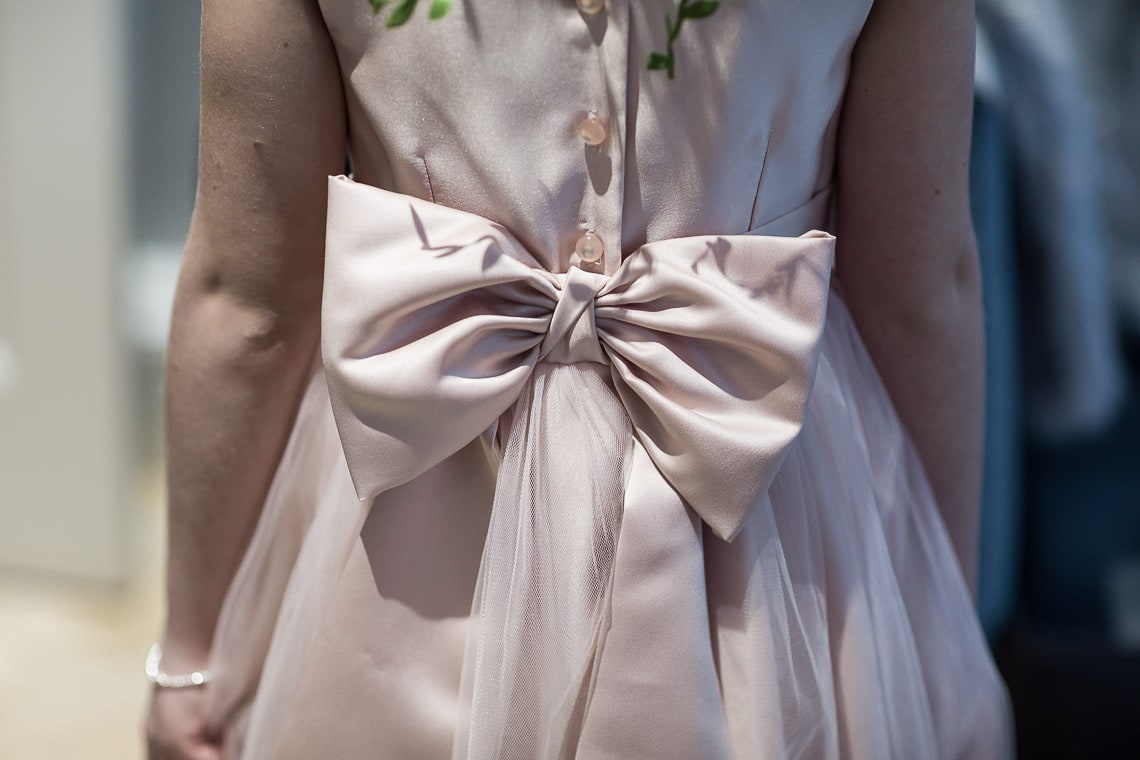 flower girl bow on the back of her dress