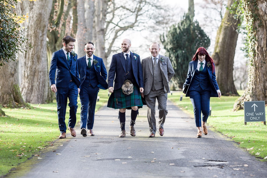 groom and best men walking to the ceremony