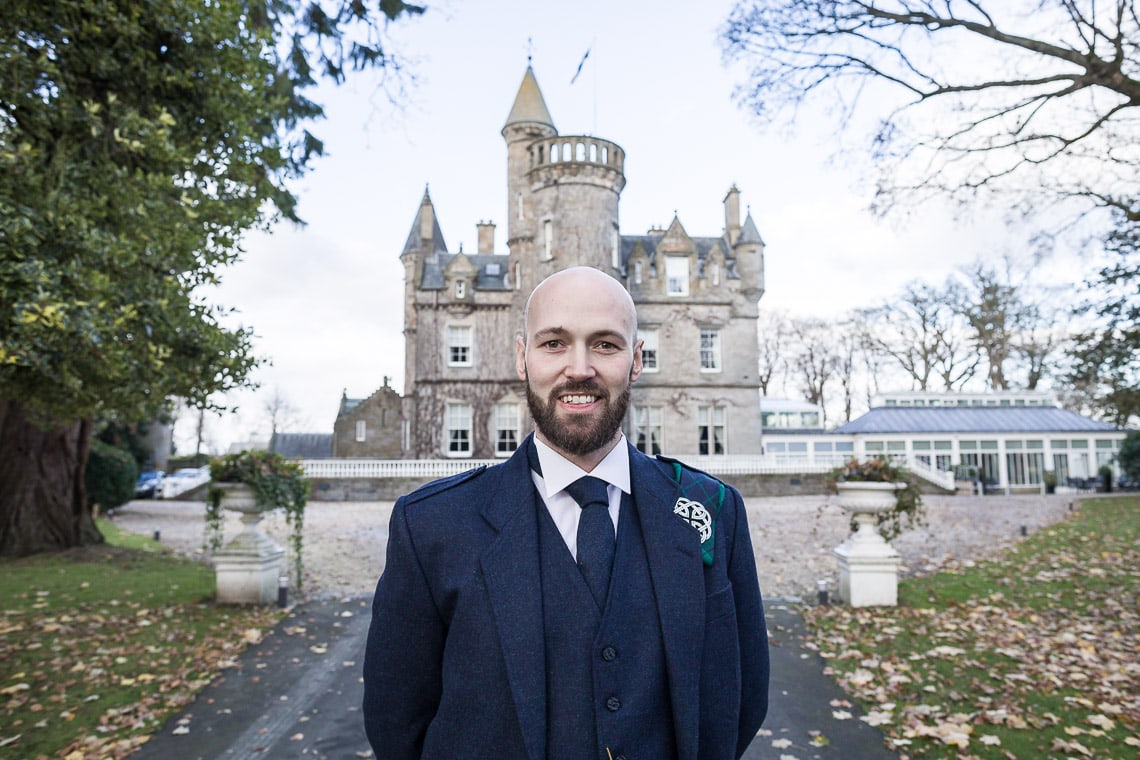 groom standing on the driveway