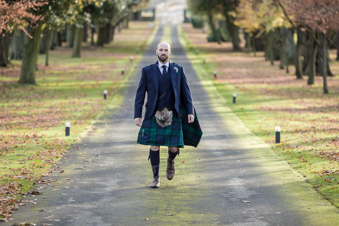 groom walking up the driveway