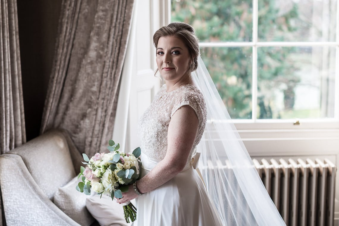 bride pre-ceremony photo in bedroom side view
