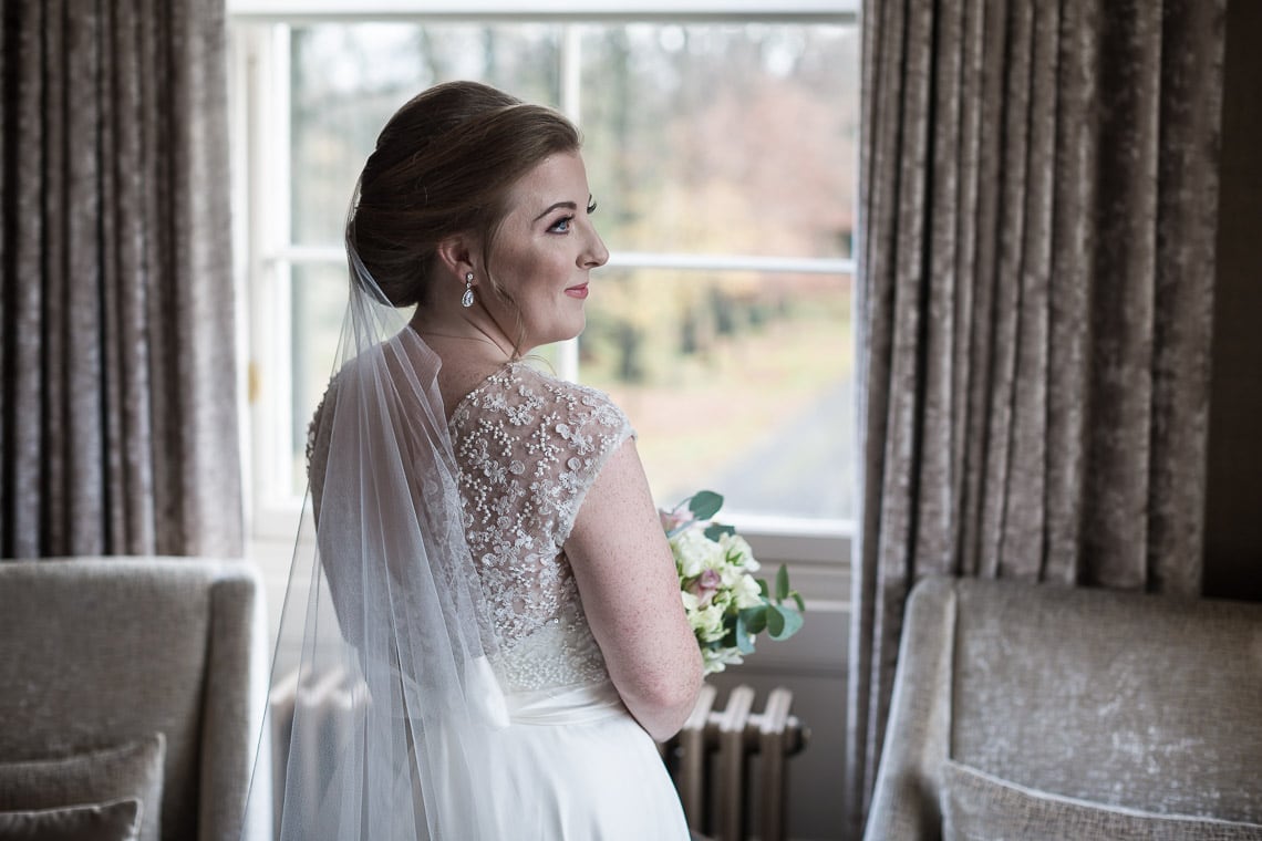 bride view of the back of the dress pre-ceremony photo in bedroom