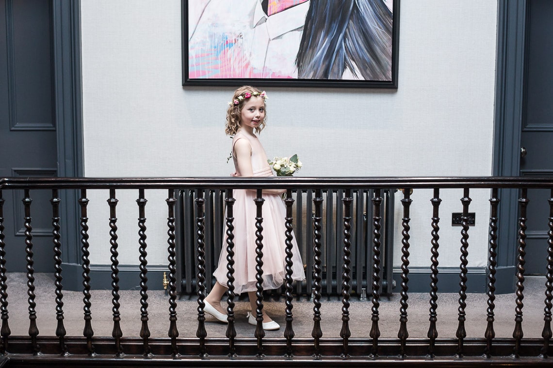 flower girl walking along the landing