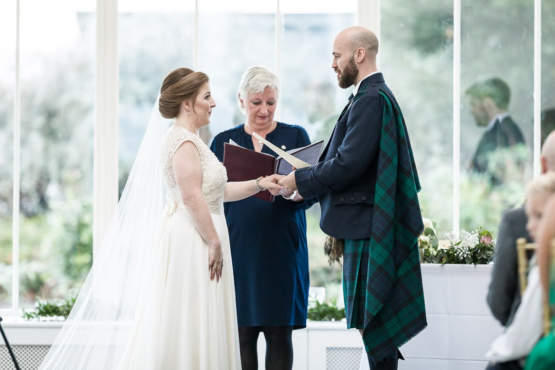 bride and groom exchanging vows