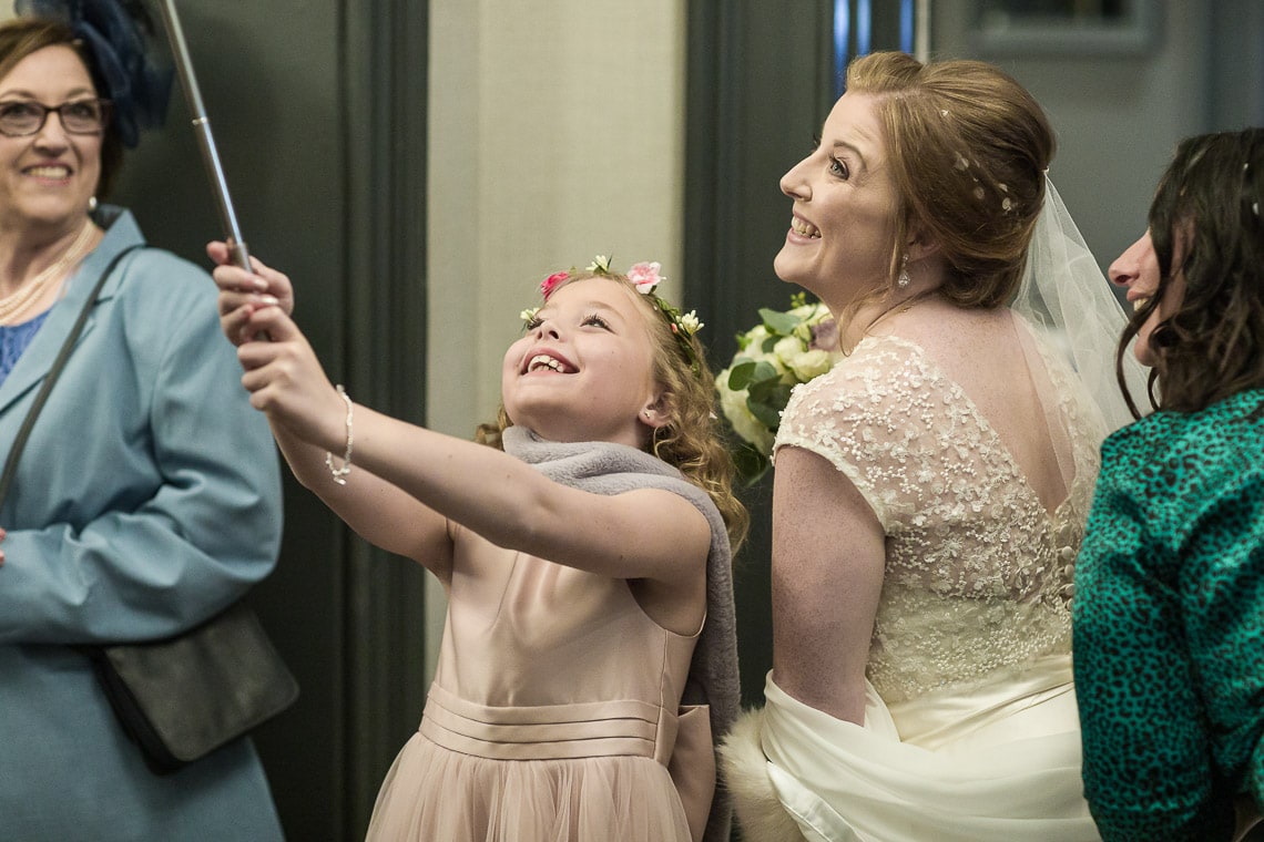 flower girl having fun with the bride