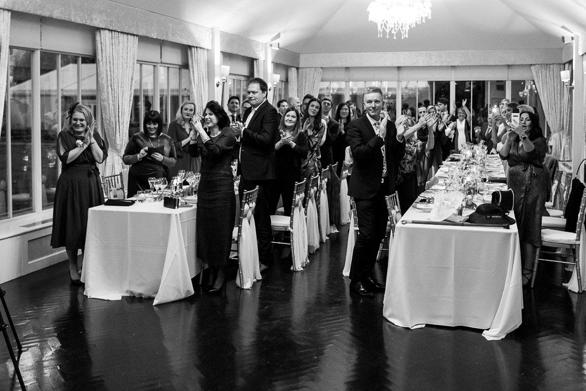 bride and groom are announced into The Orangery and guests are cheering