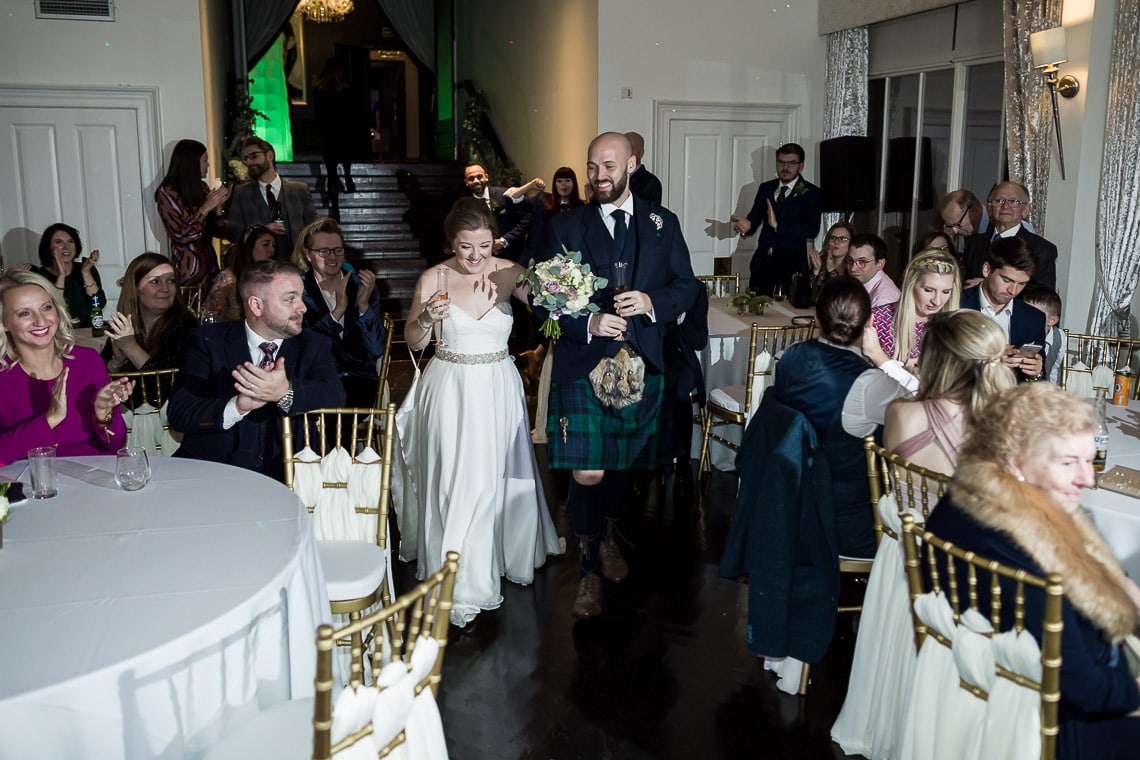 bride and groom are announced into The Orangery for the evening reception