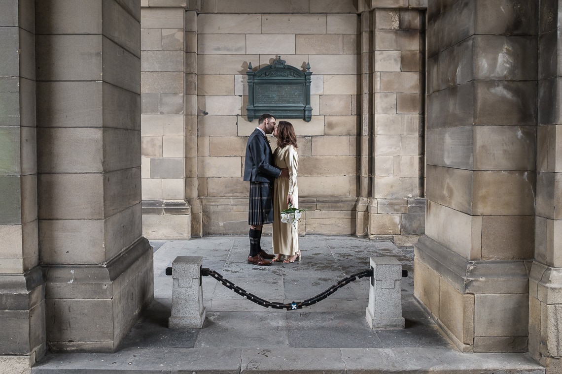 newlyweds standing together at The Quadrant