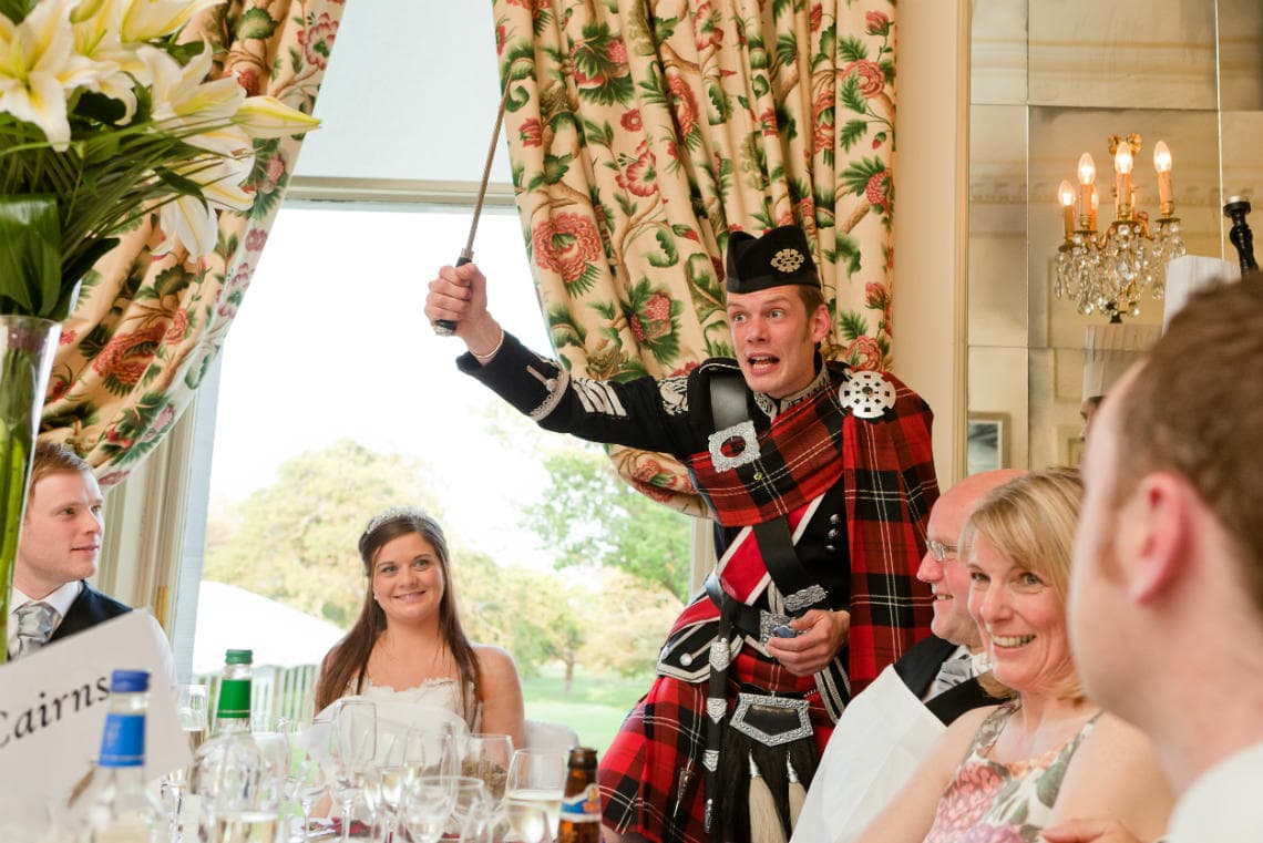 Croquet Room piper draws dirk to address the haggis