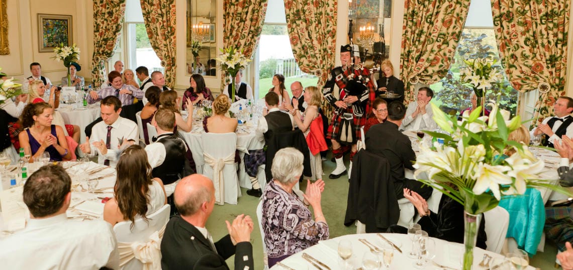 Croquet Room piper plays as he departs