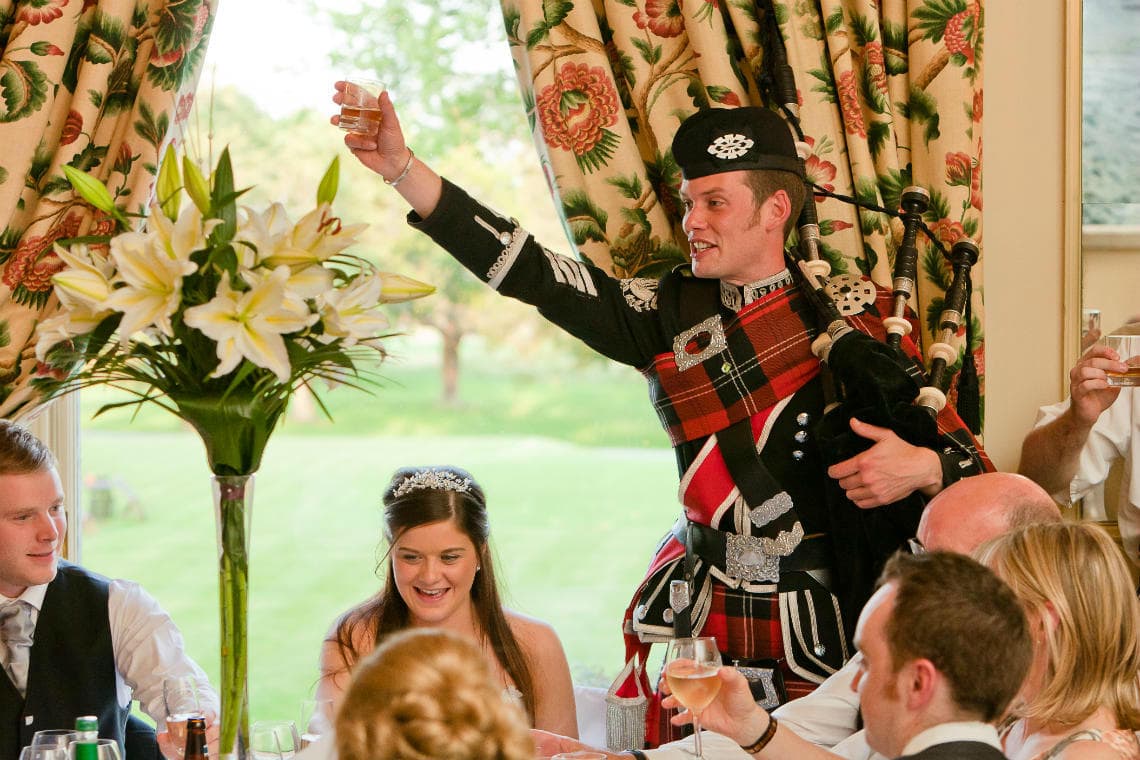 Croquet Room piper toasts the newlyweds