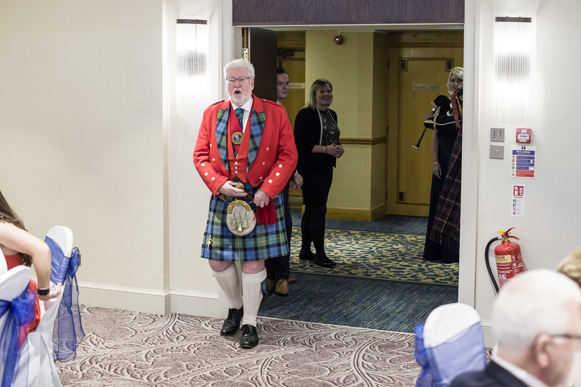 Toastmaster John Smith announces the top table guests