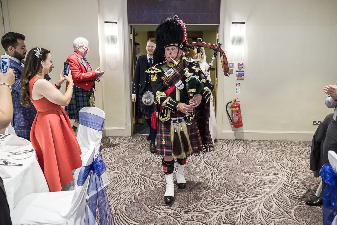 Piper leads newlyweds to the top table
