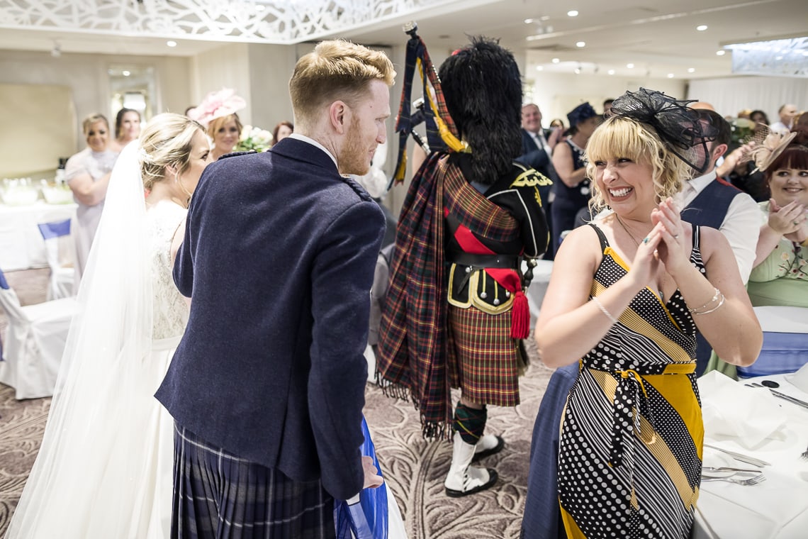 newlyweds making their way to the top table