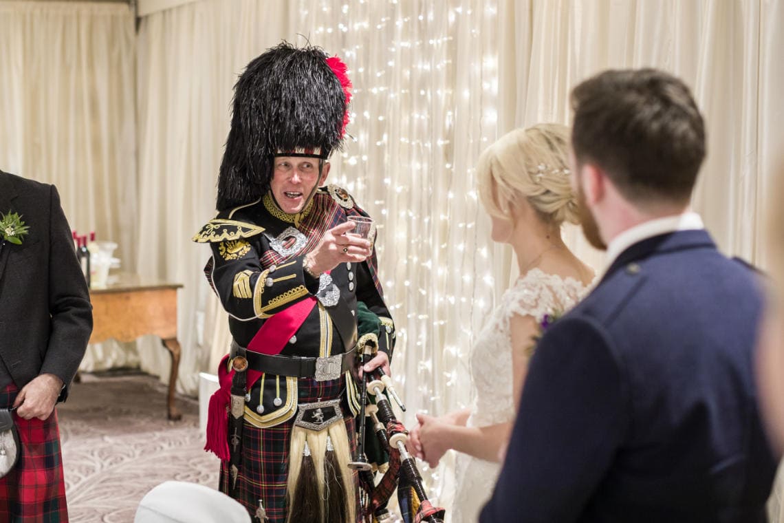 Dalmahoy Suite - piper raises a toast to the newlyweds