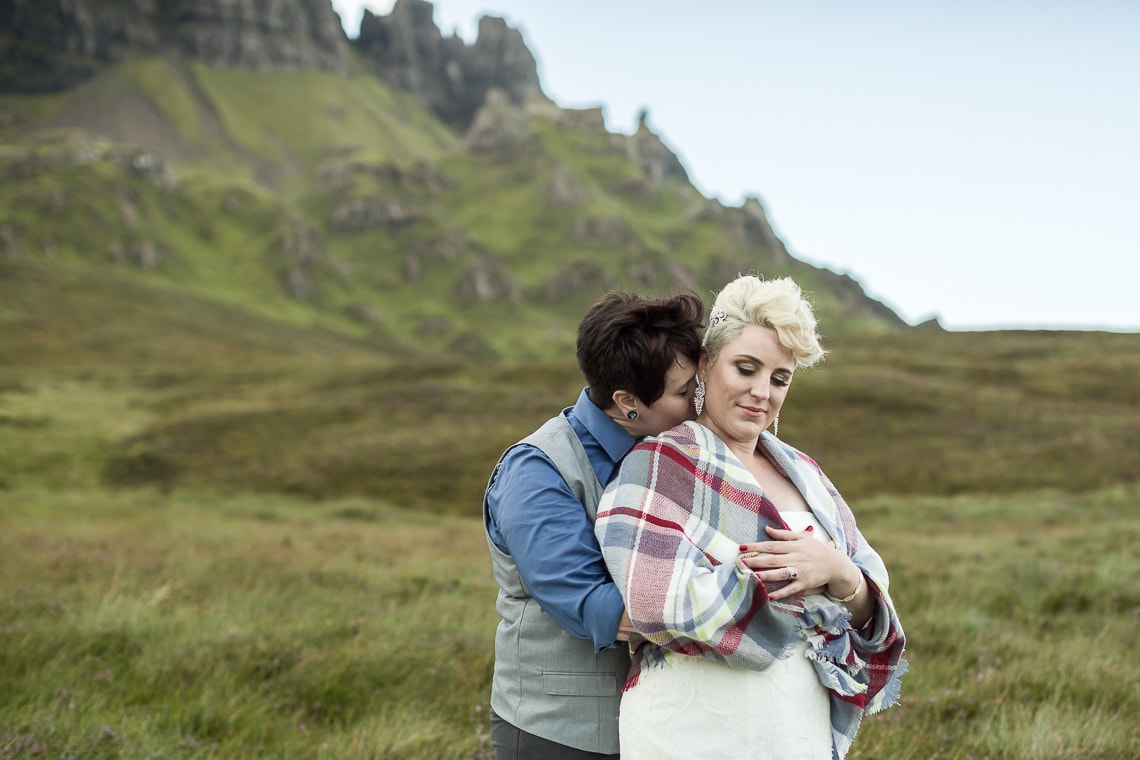 newly-wed lesbian couple embrace