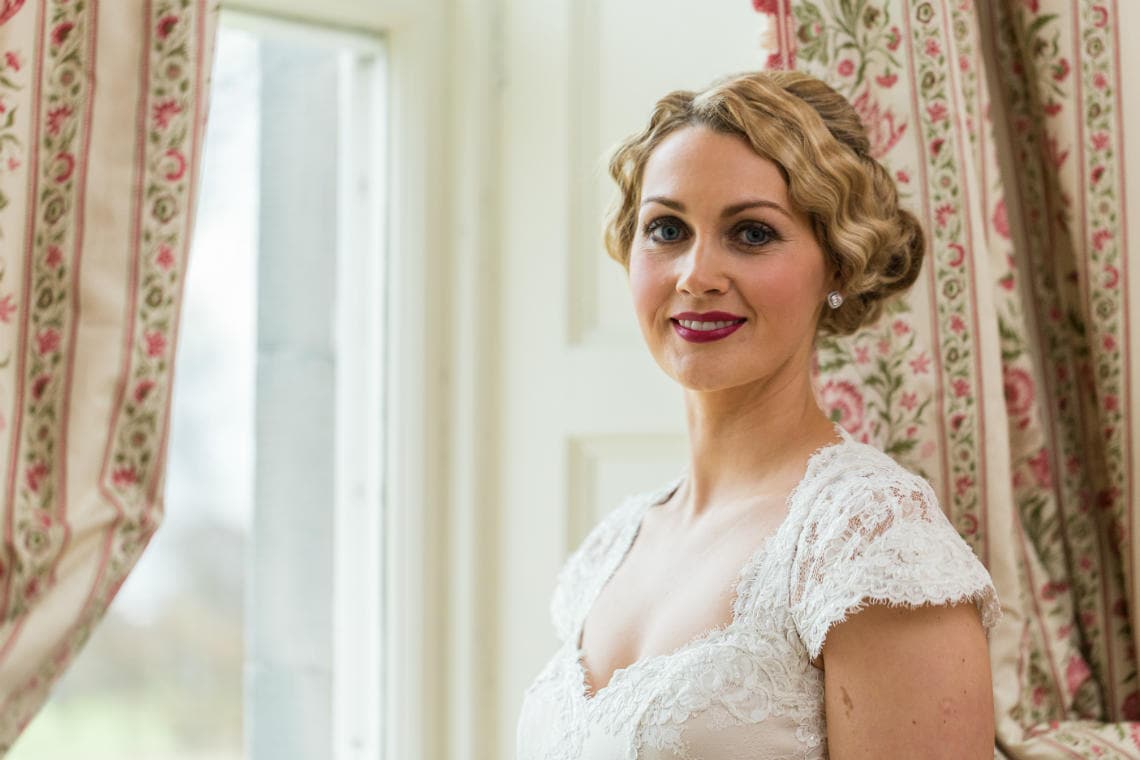 bridal portrait by the window in the Winter bedroom