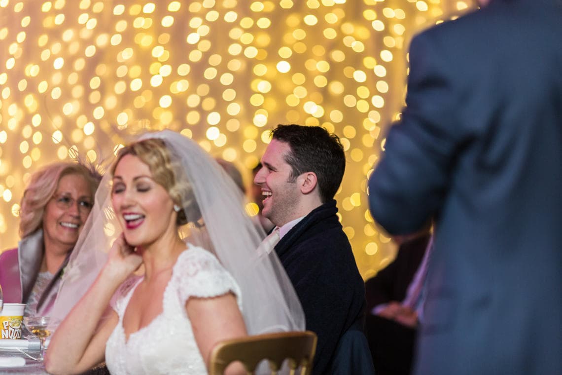 bride and groom laughing during the best man's speech in The Pavilion