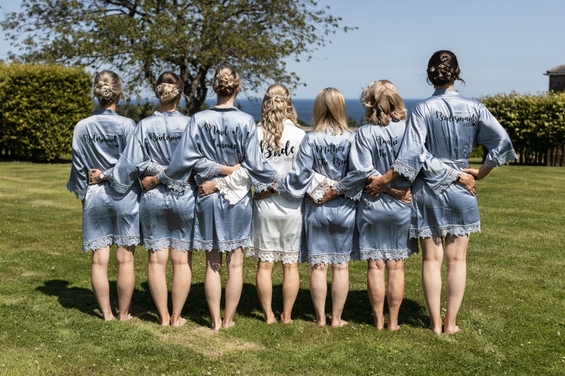 bride and bridesmaids rear view wearing gowns