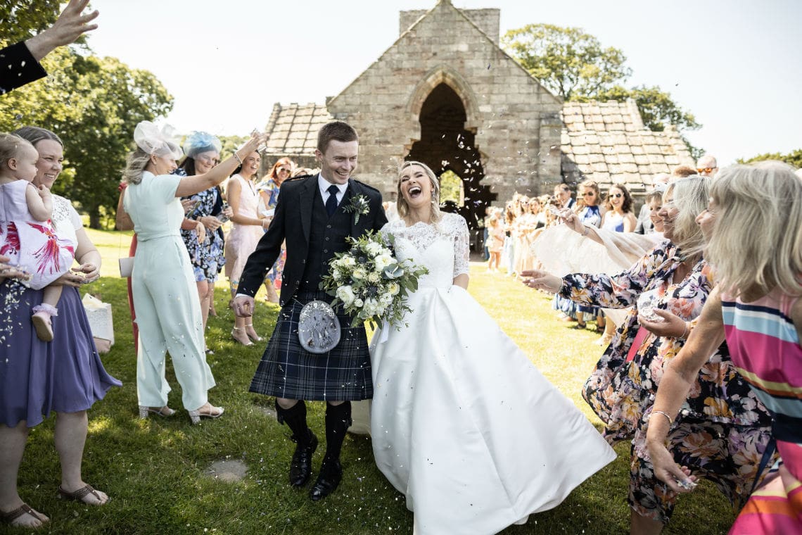confetti shower newlyweds viewed from the front