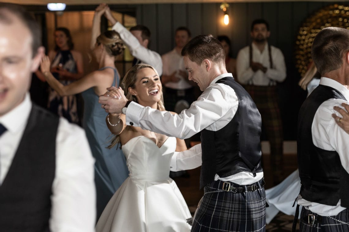 bride and groom dancing