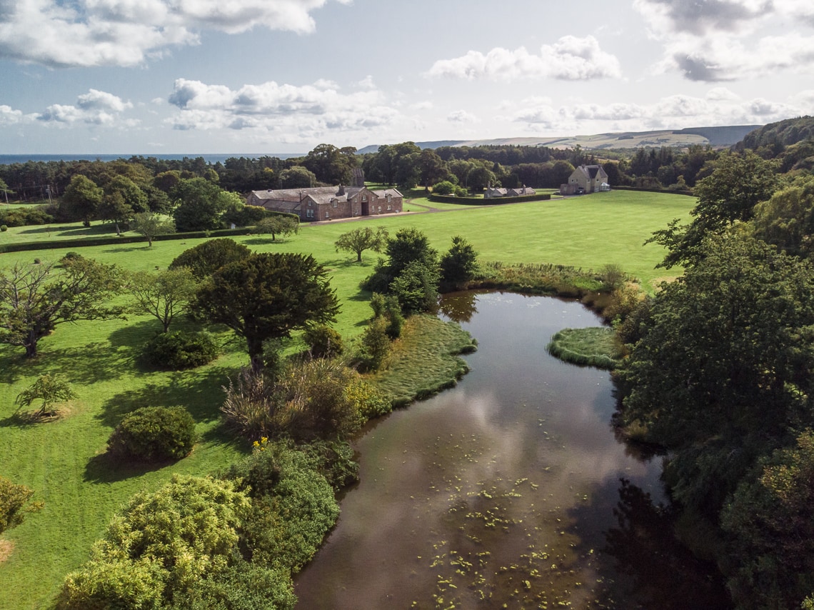 aerial photo of pond and Courtyard Cottages