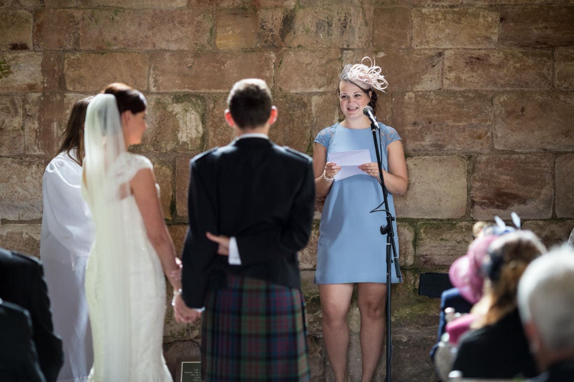 female guest doing a reading in the church